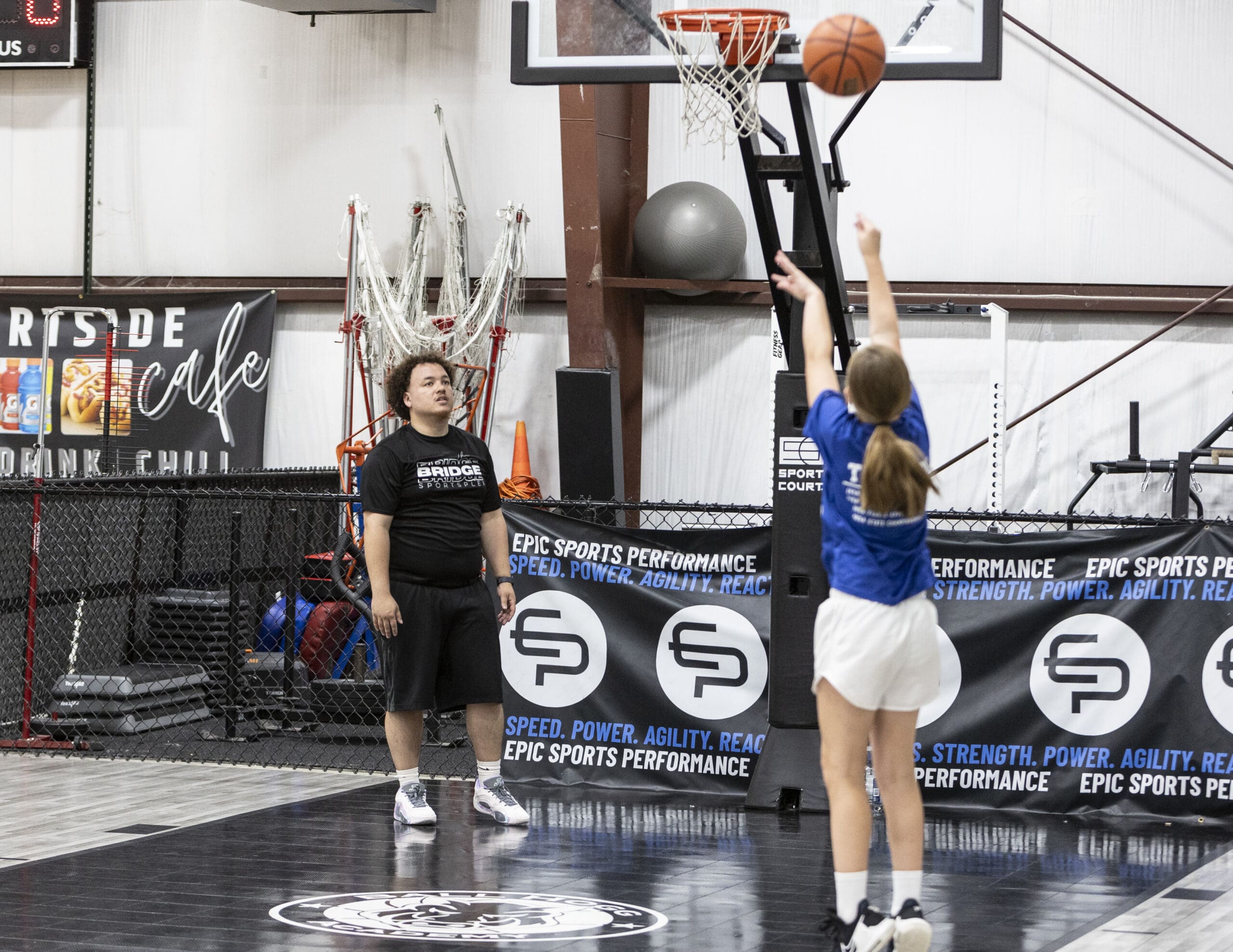 Girl on basketball court at The Bridge Sportsplex